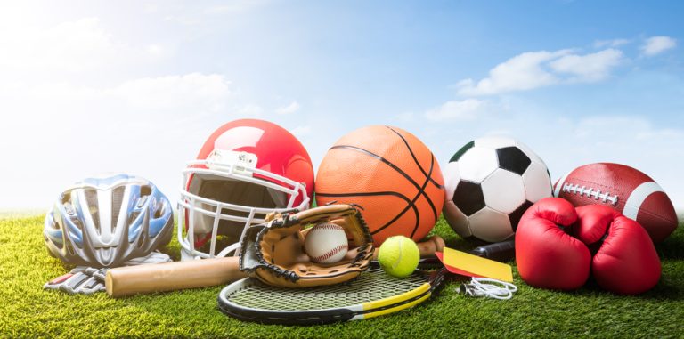 various,sport,equipment,and,balls,on,grass
